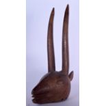 AN AFRICAN CARVED WOODEN HEADDRESS, in the form of an antelope. 54 cm high.