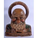 A 1920S BAVARIAN BLACK FOREST POLYCHROMED CARVING OF AN OLD MAN by Edo Lang. 20 cm x 30 cm.