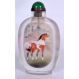 A CHINESE REVERSE PAINTED SNUFF BOTTLE, decorated with a horse in a landscape. 13.5 cm.