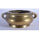 A 19TH CENTURY CHINESE TWIN HANDLED BRONZE CENSER bearing Xuande marks to base. 12 cm wide, interna