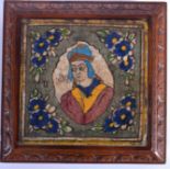 A 19TH CENTURY PERSIAN ISLAMIC MIDDLE EASTERN TILE painted with a central royal portrait. Tile 19 c
