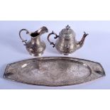 A LOVELY 19TH CENTURY PERSIAN SILVER TEA SET engraved with foliage. 36 oz. Tray 32 cm long. (3)
