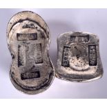 TWO CHINESE WHITE METAL INGOTS. Largest 8.75 cm wide. (2)