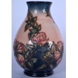 A MOORCROFT VASE, possibly Briar Rose pattern. 20 cm