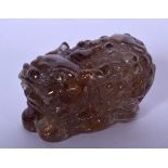 A CHINESE ROCK CRYSTAL TYPE FIGURE, formed as a mythical beast. 7 cm wide.