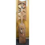 A LARGE AFRICAN CARVED LWALWA TYPE WOODEN MASK, partially polychromed with square cut eyes. 150 cm