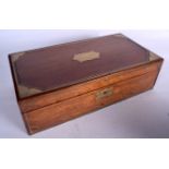 AN EARLY 20TH CENTURY WOODEN WRITING SLOPE BOX, inset with brass cartouche and escutcheon. 13.5 cm