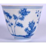 A CHINESE BLUE AND WHITE PORCELAIN WINE CUP BEARING CHENHUA MARKS, decorated with a flowering tree.