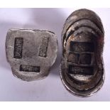 TWO CHINESE WHITE METAL INGOTS, varying design. Largest 7 cm wide. (2)