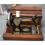 A VINTAGE SINGER SEWING MACHINE, with original case. 44 cm wide.