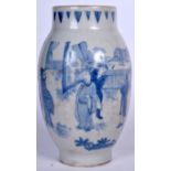 A CHINESE BLUE AND WHITE TRANSITIONAL STYLE PORCELAIN VASE, decorated with figures in a fenced gard