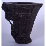 A GOOD CHINESE CARVED BAMBOO LIBATION CUP, formed with chilong and taotie mask head decoration. 10