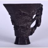 A CHINESE CARVED BAMBOO LIBATION CUP, decorated with flowering shoots. 10 cm x 9.5 cm.