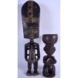 AN AFRICAN TRIBAL CARVED WOOD TRIBAL FERTILITY BOWL together with another similar figure. 30 cm & 4
