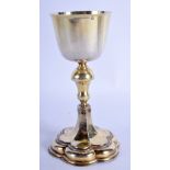 A 17TH CENTURY EUROPEAN SILVER GILT GOBLET with unusual petal form base. 3.9 oz. 16 cm high.