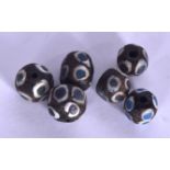 SIX CENTRAL ASIAN GLASS BEADS. 1.5 cm wide. (6)
