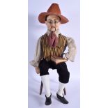 A VICTORIAN AUTOMATON FIGURE OF A SEATED MALE modelled wearing a yellow and black waistcoat. 48 cm