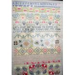 AN EMBROIDERED SAMPLER, a copy of Grace Catlins 1719 example. 63 cm x 42 cm.