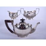 A SILVER THREE PIECE TEASET. Birmingham 1944. 13.6 oz. Largest 21 cm wide. (3)