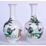 A PAIR OF CHINESE FAMILLE VERTE PORCELAIN VASE, decorated in the Kangxi style. 21.5 cm high.