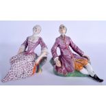 A PAIR OF 18TH CENTURY DUTCH DELFT FIGURES OF A MALE AND FEMALE C1750 modelled resting upon outcrop