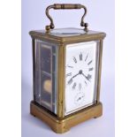 A LARGE ANTIQUE BRASS CARRIAGE CLOCK. 18 cm high inc handle.