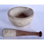 AN ANTIQUE CARVED STONE PESTLE & MORTAR. Mortar 18 cm wide. (2)