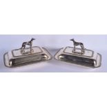 A PAIR OF 1950S SILVER PLATED GREYHOUND SERVING TUREENS AND COVERS. 28 cm x 18 cm.