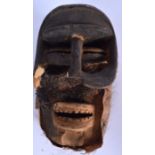 AN AFRICAN WOODEN WOYO MASK, formed with a hide beard. 26 cm x 15 cm.