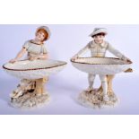 A PAIR OF 19TH CENTURY WORCESTER HADLEY FIGURAL SWEETMEAT DISHES modelled as a boy and girl. 25 cm