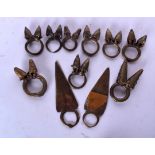 NINE GHANAIAN ASHANTI RINGS, together with two other rings. (11)