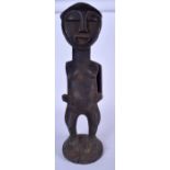 A GABONESE FANG RELIQUARY GUARDIAN, formed standing. 61 cm high.