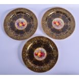 Royal Worcester three art deco style plates painted with fruit by E. Townsend, two signed, on an un