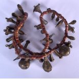 AN AFRICAN BRONZE AND HARDSTONE NECKLACE, formed with varied decorative items including bells. 76 c
