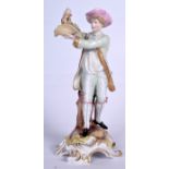 A SITZENDORF PORCELAIN FIGURINE OF A MALE, modelled holding a basket of flowers. 28 cm high.