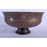 A LARGE 17TH CENTURY SAFAVID TINNED COPPER BOWL Persia, decorated with extensive scripture and foli