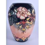 A MOORCROFT HONEYSUCKLE VASE. 20.5 cm high.