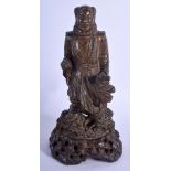 AN 18TH/19TH CENTURY CHINESE CARVED JADE SOAPSTONE FIGURE OF A BUDDHA modelled upon a naturalistic