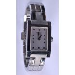 A LADIES TISSOT STAINLESS STEEL WRISTWATCH. 1.75 cm x 2.5 cm.