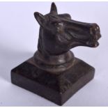 A CHINESE BRONZE SEAL, formed with a horse head. 4.5 cm high.