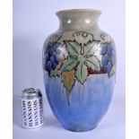 A LARGE ROYAL DOULTON LAMBETH STONEWARE VASE painted with fruit and vines. 35 cm x 15 cm.