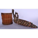 A MALIAN BAMBARA WICKER BASKET TYPE ARTICLE, together with a polychromed mask. Mask 57 cm long. (2)