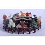 A VERY UNUSUAL 19TH CENTURY CHINESE CARVED JADE AGATE AND JADEITE ZODIAC GROUP Late Qing, upon a fi