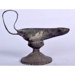 A ROMAN BRONZE OIL LAMP, formed with a high loop handle. 13 cm x 16.5 cm.