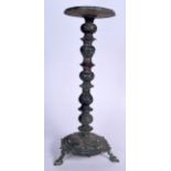 A LARGE ISLAMIC BRONZE OIL LAMP, incised with symbols. 48.5 cm high.