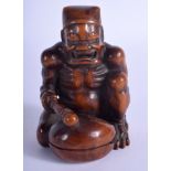 A FINE 19TH CENTURY JAPANESE MEIJI PERIOD CARVED BOXWOOD OKIMONO modelled as a Buddhistic oni beati