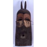 A CONGOLESE WABEMBE TRIBE POLYCHROMED GOMA MASK, carved with protruding eyes. 48 cm long.