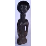 A NIGERIAN YORUBA CARVED WOODEN STATUE, formed as a standing figure with an elongated neck. 61 cm h