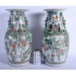 A FINE LARGE PAIR OF 19TH CENTURY CHINESE FAMILLE VERTE PORCELAIN VASES Qing, painted with figures