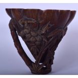 A CHINESE BUFFALO HORN LIBATION CUP, carved with foliage. 14.5 cm x 16 cm.